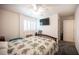 Cozy bedroom showcasing a ceiling fan, window with shutters, and a comfortable bed at 4652 Wyncrest Ave, Las Vegas, NV 89115