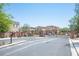 Welcoming community entrance featuring attractive landscaping and security gate at 4652 Wyncrest Ave, Las Vegas, NV 89115
