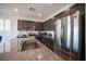 Modern kitchen featuring granite countertops, stainless steel appliances, and ample cabinet space at 4652 Wyncrest Ave, Las Vegas, NV 89115