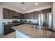 Modern kitchen featuring granite countertops, stainless steel appliances, and ample cabinet space at 4652 Wyncrest Ave, Las Vegas, NV 89115