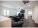 Bright living area with a large sectional sofa, media center, and a glimpse into another room at 4652 Wyncrest Ave, Las Vegas, NV 89115