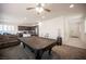 Spacious living area featuring modern furnishings and a pool table at 4652 Wyncrest Ave, Las Vegas, NV 89115