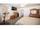 Comfortable main bedroom with a mounted TV, a dresser, and an ensuite bathroom with a shower at 4652 Wyncrest Ave, Las Vegas, NV 89115