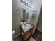 Bathroom vanity with good storage and modern light fixture at 4730 E Craig Rd # 1106, Las Vegas, NV 89115