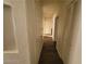 Hallway featuring a linen closet and modern wood floors at 4730 E Craig Rd # 1106, Las Vegas, NV 89115