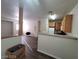 Bright living area with wood-look floors and open layout with a glimpse of the kitchen at 4730 E Craig Rd # 1106, Las Vegas, NV 89115