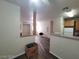 Bright living area featuring wood-look floors and open layout with a glimpse of the kitchen at 4730 E Craig Rd # 1106, Las Vegas, NV 89115