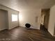 Open living room featuring modern wood floors and a bright window at 4730 E Craig Rd # 1106, Las Vegas, NV 89115