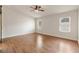 Minimalist bedroom with ceiling fan, hardwood floors and natural light at 4904 Wiltondale Way, Las Vegas, NV 89130