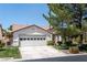 Beautiful single-story home featuring a two-car garage, well-manicured lawn, and mature landscaping at 4904 Wiltondale Way, Las Vegas, NV 89130