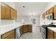 Updated kitchen with stainless steel appliances and white tiled countertops at 4904 Wiltondale Way, Las Vegas, NV 89130