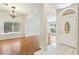 Bright living room featuring hardwood floors and a modern lighting fixture at 4904 Wiltondale Way, Las Vegas, NV 89130