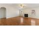 Spacious living room with hardwood floors, a fireplace, and ample natural light at 4904 Wiltondale Way, Las Vegas, NV 89130