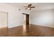 Bright main bedroom with ceiling fan, hardwood floors, ensuite bathroom with stylish barn door at 4904 Wiltondale Way, Las Vegas, NV 89130