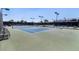 Well-maintained tennis court with lights and seating offers recreational opportunities for active residents and guests at 4904 Wiltondale Way, Las Vegas, NV 89130