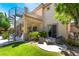 Backyard patio with spiral staircase, outdoor seating, and lush landscaping at 5186 San Milano Ave, Las Vegas, NV 89141