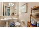 Powder bathroom features a sink with vintage faucet and toilet at 5186 San Milano Ave, Las Vegas, NV 89141