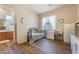 Neutral bedroom with a bed, desk, wardrobe, and wood-look floors creating a serene and inviting atmosphere at 5186 San Milano Ave, Las Vegas, NV 89141