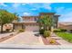 Beautiful two-story home with a well-manicured lawn and a three-car garage in a desirable neighborhood at 5186 San Milano Ave, Las Vegas, NV 89141