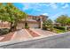 Charming home boasts a spacious three-car garage, mature landscaping, and inviting curb appeal at 5186 San Milano Ave, Las Vegas, NV 89141