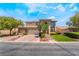 Stunning two-story home with a three-car garage, well-manicured lawn, and mature trees offering curb appeal at 5186 San Milano Ave, Las Vegas, NV 89141