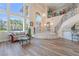 Bright foyer showcasing the staircase, large windows, and stylish decor, creating a welcoming atmosphere at 5186 San Milano Ave, Las Vegas, NV 89141