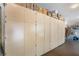 Garage features full wall of built in cabinets with room for storage boxes at 5186 San Milano Ave, Las Vegas, NV 89141