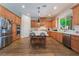 Spacious kitchen with stainless steel appliances, a center island with seating, and ample counter space at 5186 San Milano Ave, Las Vegas, NV 89141