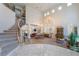 A grand living area features a spiral staircase, high ceilings, and abundant natural light at 5186 San Milano Ave, Las Vegas, NV 89141