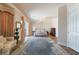 Bright primary bedroom with an ornate rug and access to an outdoor balcony at 5186 San Milano Ave, Las Vegas, NV 89141