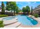 Refreshing swimming pool and spa surrounded by a well-maintained yard, perfect for summer days at 5186 San Milano Ave, Las Vegas, NV 89141