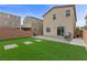 Spacious backyard with artificial turf, brick patio and plenty of space for outdoor entertaining at 5255 Peak Rock Ct, Las Vegas, NV 89141