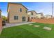 Exterior view of backyard with patio, grass, and backyard privacy wall at 5255 Peak Rock Ct, Las Vegas, NV 89141