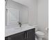 This bathroom features a dark-stained vanity and modern fixtures at 5255 Peak Rock Ct, Las Vegas, NV 89141