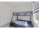 Bedroom features a bunk bed, large closet, and a window at 5255 Peak Rock Ct, Las Vegas, NV 89141