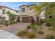 Charming two-story home with a two car garage and desert landscaping for low maintenance at 5255 Peak Rock Ct, Las Vegas, NV 89141
