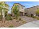 Charming two-story home with a two car garage and well-maintained front yard featuring desert landscaping at 5255 Peak Rock Ct, Las Vegas, NV 89141
