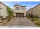 Lovely home featuring neutral tones, a two car garage and desert landscaping for low maintenance at 5255 Peak Rock Ct, Las Vegas, NV 89141