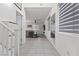 Hallway leading to living space offers neutral colors, lots of light, and stylish staircase at 5255 Peak Rock Ct, Las Vegas, NV 89141