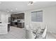 Modern kitchen features stainless steel appliances, gray cabinetry and eat-in dining area at 5255 Peak Rock Ct, Las Vegas, NV 89141