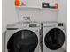 Laundry room features a side-by-side washer and dryer and overhead shelf at 5255 Peak Rock Ct, Las Vegas, NV 89141