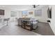Cozy living room features modern decor, tile flooring, and seamless flow to the dining and kitchen areas at 5255 Peak Rock Ct, Las Vegas, NV 89141