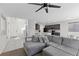 Bright living room showcasing open floor plan with modern kitchen, dining area, and comfortable living space at 5255 Peak Rock Ct, Las Vegas, NV 89141