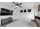 Spacious main bedroom featuring a ceiling fan, neutral decor and light carpet at 5255 Peak Rock Ct, Las Vegas, NV 89141