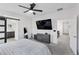 Main bedroom boasts an en suite bathroom with gray finishings and TV at 5255 Peak Rock Ct, Las Vegas, NV 89141