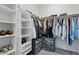 Walk-in closet offers ample storage with shelving, hanging rods, and pull-out storage at 5255 Peak Rock Ct, Las Vegas, NV 89141