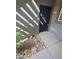 Apartment entrance with well maintained landscaping, shade and number 1123 at 555 E Silverado Ranch Blvd # 1123, Las Vegas, NV 89183
