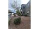 Apartment building exterior with well-maintained landscaping and covered parking at 555 E Silverado Ranch Blvd # 1123, Las Vegas, NV 89183