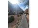 Exterior view of the apartment building with a sidewalk and landscaping at 555 E Silverado Ranch Blvd # 1123, Las Vegas, NV 89183