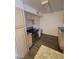 Kitchen area with stainless steel oven, granite counters, and vinyl flooring at 555 E Silverado Ranch Blvd # 1123, Las Vegas, NV 89183